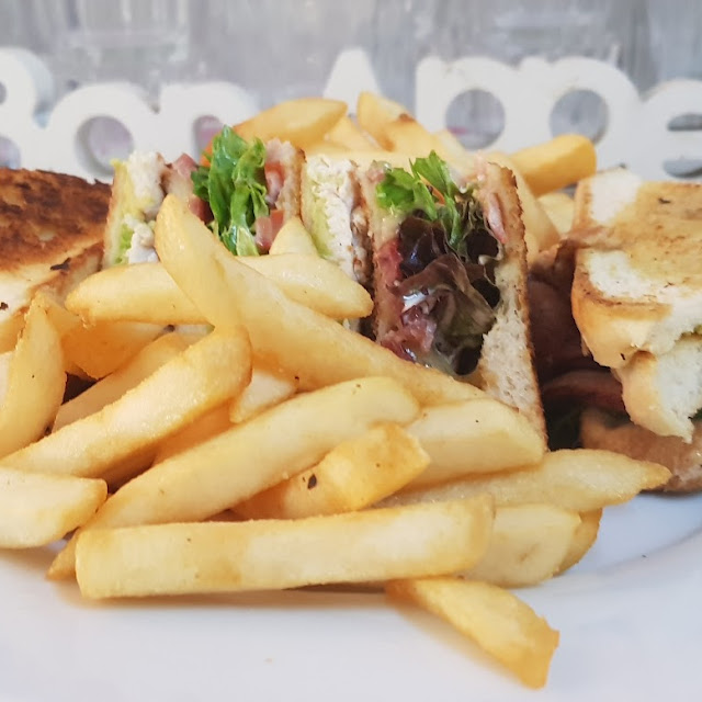 Club Sandwich with Chicken Breast Bacon Lettuce Cheese Tomato Mayo Avocado & Chips